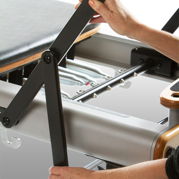 Professional Studio Reformer with Large Footplate, Adjustable Four-Position Gear Bar, Locking Foot Bar, Vertical Storage Design, and Integrated Side-Split Platform for Group Classes